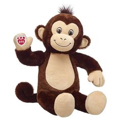 a stuffed monkey sitting on its hind legs