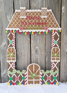 a gingerbread house is decorated with candy canes