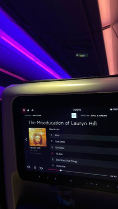 the entertainment screen on an airplane with purple lights