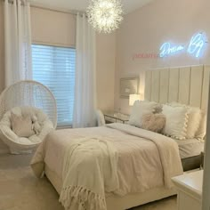 a bed room with a neatly made bed and a hanging chair