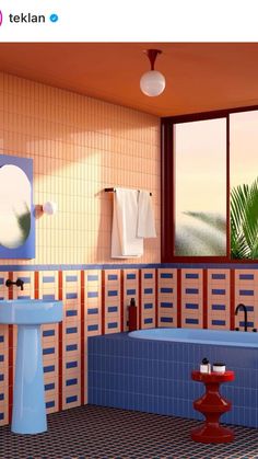 a bathroom with blue and red tiles on the walls