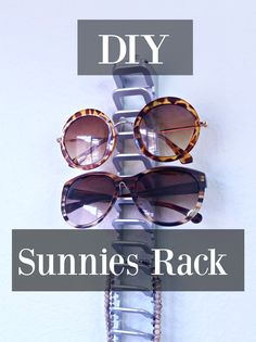 some sunglasses are hanging on a rack with the words diy summer's rack