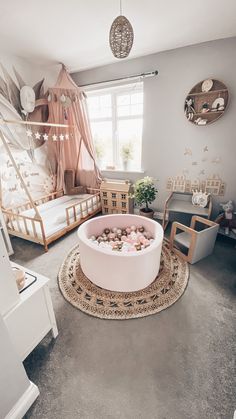 a living room filled with lots of furniture and decor on top of carpeted flooring