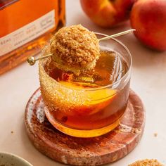 an apple cider is sitting on top of a plate