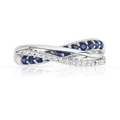 a white gold ring with blue sapphires and diamonds