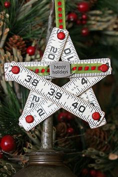 a christmas ornament that has been made to look like a star with measuring tape on it