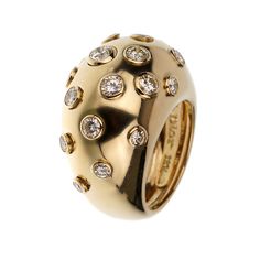 The Christian Dior Vintage Bombe Diamond 18k Yellow Gold Cocktail Ring is an exquisite piece that exemplifies the elegance and luxury synonymous with the Dior brand. This stunning cocktail ring is a perfect blend of classic design and sophisticated glamour, making it a must-have for any jewelry connoisseur. Crafted from 18k yellow gold, this ring features a bold and distinctive bombe design. The bombe style, characterized by its rounded, dome-like shape, creates a striking silhouette that is both eye-catching and timeless. The warm, rich hue of the yellow gold adds a touch of opulence, enhancing the overall allure of the piece. The surface of the ring is adorned with numerous bezel-set diamonds, each meticulously chosen for its brilliance and clarity. These diamonds are strategically place Dior Brand, Victoire De Castellane, Delicate Engagement Ring, Yellow Gold Cocktail Ring, Dior Vintage, Gold Cocktail Ring, Dior Jewelry, Gold Cocktail, Bezel Set Diamond