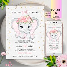 an elephant baby shower card with pink flowers on it and a phone next to it