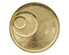 a gold plate with a spiral design on it