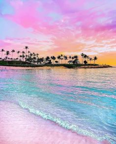 the beach is pink and blue with palm trees in the background