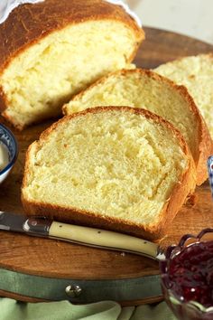 slices of bread on a cutting board with butter and jelly