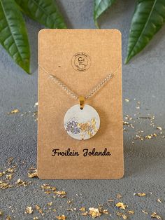 the necklace is on display in front of a card that says, freshen island