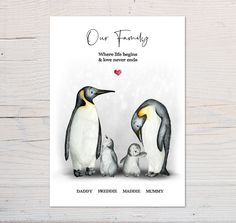 a card with two penguins and a baby penguin