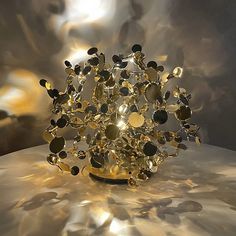 a sculpture made out of gold and black stones