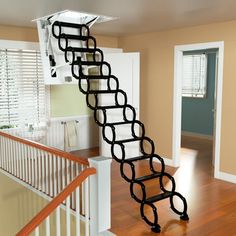 a staircase made out of metal links in a house