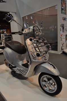 a scooter is on display in a showroom