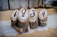 four logs with numbers on them sitting on a table