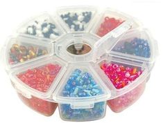 a plastic container filled with lots of different colored beads