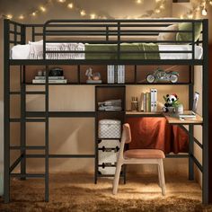 a bunk bed with a desk underneath it and lights strung over the top of it