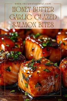 honey butter garlic glazed salmon bites on a plate with text overlay that reads honey butter garlic glazed salmon bites