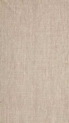 a close up view of a beige fabric texture