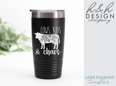 a black tumbler cup with the words cows, kids and chaos on it