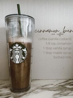 a starbucks coffee drink is shown on a marble counter top with information about the product