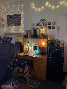 a dorm room with lights and decorations on the walls