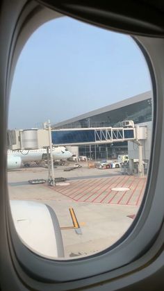 looking out an airplane window at the airport