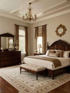 a bedroom with a large bed, dresser and mirror in it's center area