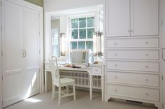 a white desk and chair in a room