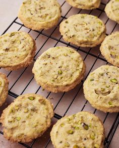 several cookies cooling on a wire rack, with pistachios in the middle