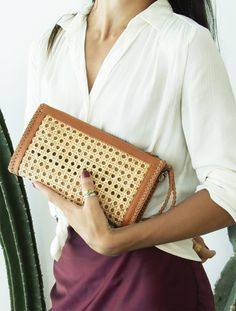 Doriane Rattan Clutch is made using leather and rattan to give a sophisticated and resort feel. Features a zip closure and a detachable handle, the bag holds items organized and neatly. Two Inside Zip Pocket Credit Card Holder Detachable Handle Measurement : Lgth ~ 31cm - 12.25 " Hght ~ 17 cm - 7 " Depth ~ 4.5cm - 1.75" Straps ~ detachable wrist handle Luxury Tan Bag With Removable Pouch, Rattan Clutch, Resort Vibes, Handmade Clutch, Bamboo Bag, Design Bag, Wicker Bags, Rattan Bag, Europe Fashion