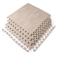 several pieces of wood are stacked on top of each other with holes in the middle