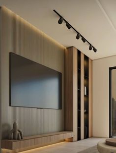 a large flat screen tv mounted to the side of a wall in a living room