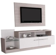 an entertainment center with a flat screen tv mounted on the wall