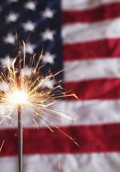 a sparkler in front of an american flag