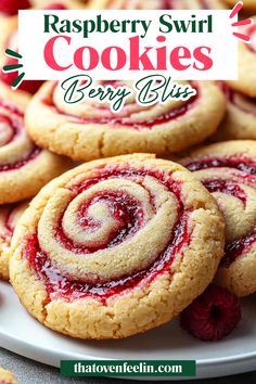 raspberry swirl cookies on a white plate with the title overlay reading raspberry swirl cookies berry bliss