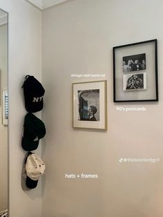 there are hats and frames on the wall