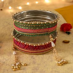 A specially curated Chalni for the auspicious celebration of Karwa Chauth, this Chalni is handmade with pure rawsilk fabric with golden & pearl colored beads that look absolutely elegant. Standard Chalni - 6.5 inches in diameter Gift this Pooja thali along with chalni for your wife who would be keeping a fast for you on the festive occasion of Karwa Chauth Karva Chauth Chalni Decoration, Navratri Banarasi Silk Sets With Latkans, Elegant Multicolor Embroidered Traditional Wear, Gold Brocade Sets For Festivals, Festive Gold Brocade Set, Gold Raw Silk Sets For Festivals, Traditional Gold Embroidered Set, Gold Sets For Traditional Ceremonies With Traditional Drape, Festive Art Silk Traditional Wear With Gota Work