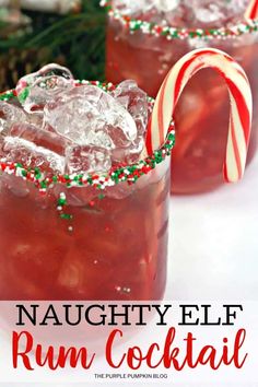 two red drinks with candy canes and peppermint on the rim, in front of a white background