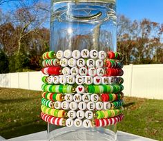 a glass jar filled with lots of colorful beads