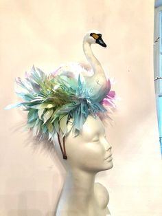 "Bird Fascinator- Horse Racing - Feather Headband- Swan Lake- Derby- Swan Headpiece- Halloween costume. Hello, It's perfect to add whimsical fun to any occasion. You'll be the life of the party with this great conversation piece This Fascinator has been featured in the New York Times, on Martha Stewart's blog and has won several hat contests! He also was also featured on Kathy Lee Gifford while she covered at Megan Markel's wedding in London! This has swan that is 10\" high with a matching puff Whimsical Headband For Royal Ascot, Whimsical Headband For Races, Whimsical Headpieces With Matching Headband For Costume Party, Whimsical Headband For Costume Party, Handmade Whimsical Headpiece For Kentucky Derby, Whimsical Headband For Kentucky Derby, Whimsical Handmade Headpiece For Kentucky Derby, Fitted Headband For Carnival Races, Fitted Carnival Headband Headpiece