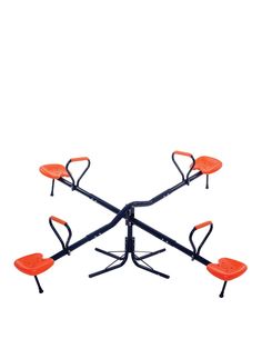 an orange chair sitting on top of a metal stand with four chairs attached to it