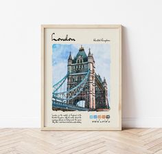 a watercolor painting of the tower bridge in london, england is displayed on a wooden floor