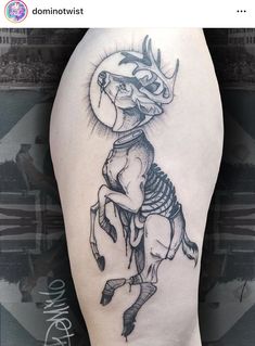 a tattoo on the leg of a person with a horse