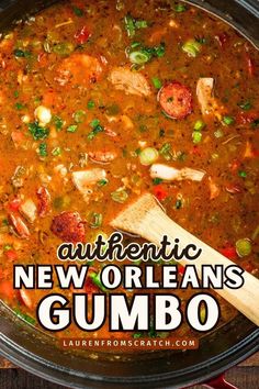 authentic new orleans gumbo soup in a pot with a wooden spoon on the side