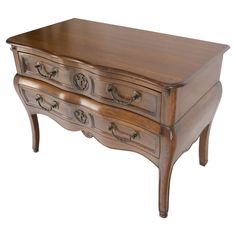 a wooden desk with drawers and handles on it's sides, against a white background