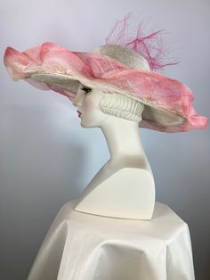 This ivory, pink and green women's straw hat is so pretty! It is completely handmade, hand blocked and one of a kind. The hat is topped with a sinamay straw brim that I tinted then embellished with a leafy vine. It's further embellished with a peachy pink silk band, handmade silk flower and wispy distressed crinoline. It is perfect for a special occasion like Kentucky Derby, Kentucky Oaks, church or summer garden party. The Wide brim makes a statement, as does the slightly asymmetrical crown. A Summer Straw Hat With High Crown, Summer High Crown Straw Hat, Summer High Crown Boater Hat For Beach, Summer Beach Boater Hat With High Crown, High Crown Straw Hat For Vacation, High Crown Sun Hat For Spring Vacation, Elegant Wide Brim Boater Hat For Country Events, Bohemian Wide Brim Pink Hat, Bohemian Pink Wide Brim Hat