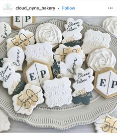 some cookies are sitting on a plate with white frosting and black lettering that says, cloud - n - bakery follow